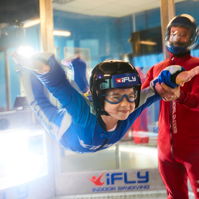 Girl indoor skydiving at Xscape