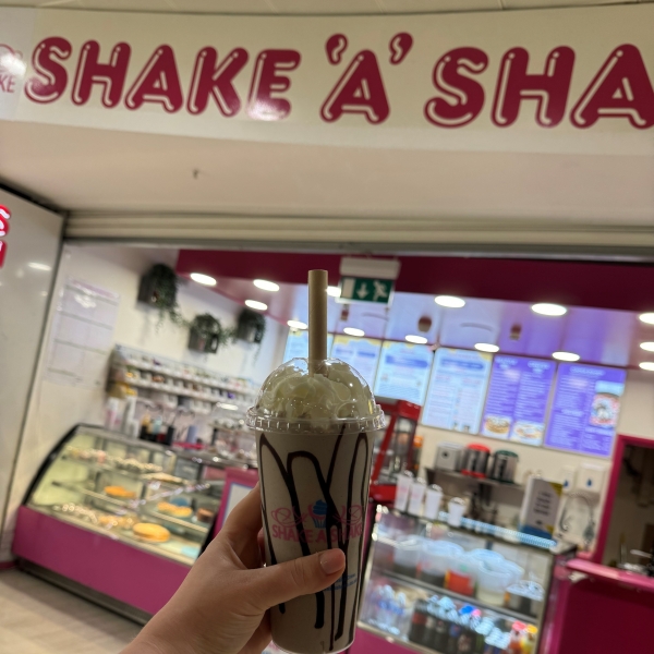 Shake a Shake milkshake in front of store